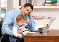 Stressed Man With Baby Working From Home Royalty Free Stock Photo