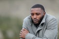 Man with black skin getting cold outdoors in winter Royalty Free Stock Photo