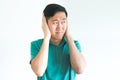 Stressed man covering his ears and do not want to hear, noise too loud. Royalty Free Stock Photo