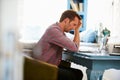 Stressed Man At Desk In Home Office With Laptop Royalty Free Stock Photo