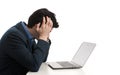Stressed man looking at his laptop computer Royalty Free Stock Photo