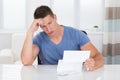 Stressed Man Looking At Paper Royalty Free Stock Photo