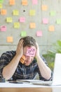 Stressed man with message on sticky notes Royalty Free Stock Photo