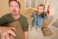 Stressed Man Moving Boxes for Demanding Wife