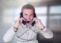 Stressed man on telephones in office Royalty Free Stock Photo