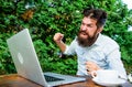 Stressed man working on laptop. agile business. solve problem. deadline. a lot of work. Frustrated office worker. angry Royalty Free Stock Photo