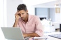 Stressed Man Working At Laptop In Home Office Royalty Free Stock Photo