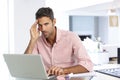 Stressed Man Working At Laptop In Home Office Royalty Free Stock Photo