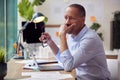 Stressed Mature Male Architect Working In Office At Desk On Plans For New Building Royalty Free Stock Photo