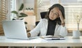 Stressed mature senior business woman suffering from headache or migraine Royalty Free Stock Photo