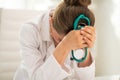 Stressed medical doctor woman in office