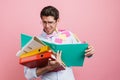 Stressed mid aged man employee holding stack Royalty Free Stock Photo