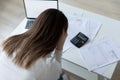 Stressed millennial woman feeling confused of banking debt.