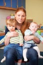 Stressed Mother With Two Young Children At Baby Group Royalty Free Stock Photo