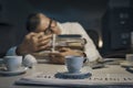 Stressed office worker sleeping at his desk Royalty Free Stock Photo