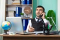 Young caucasian business man talking on the phone at office Royalty Free Stock Photo