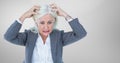 Stressed older woman against grey background