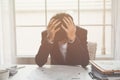 A stressed out business man holds his head in despair Royalty Free Stock Photo