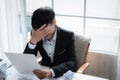 A stressed out business man holds his head in despair Royalty Free Stock Photo