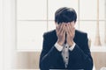 A stressed out business man holds his head in despair Royalty Free Stock Photo