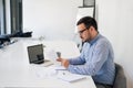 Stressed out businessman in office making important decision about serious problem working under pressure and tight deadline Royalty Free Stock Photo