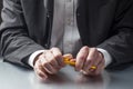 Stressed out businessman thinking at his desk with focus on his hands