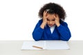 Stressed out primary girl child holding her head Royalty Free Stock Photo