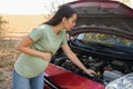 Stressed pregnant woman near broken car outdoors Royalty Free Stock Photo