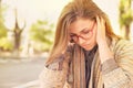 Stressed sad woman sitting outdoors. City urban life style stress Royalty Free Stock Photo