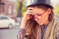 Stressed sad woman sitting outdoors. City urban life style stress Royalty Free Stock Photo