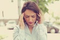 Stressed sad young woman standing outdoors. City life style stress Royalty Free Stock Photo