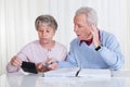 Stressed senior couple calculating budget Royalty Free Stock Photo