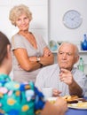 Stressed senior couple having conversation with female Royalty Free Stock Photo