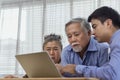 Stressed and serious retired Asian senior eldery couple consult with personal financial advisor or real estate agent about debt