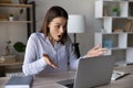 Stressed shocked computer user staring at laptop screen Royalty Free Stock Photo