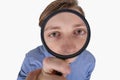 Stressed student looking through a magnifying glass. Difficult task concept, discontent guy looks lost, dissatisfied expression,