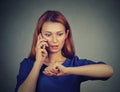 Stressed surprised business woman looking at wrist watch, running late Royalty Free Stock Photo