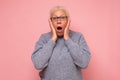 Stressed surprised old mature woman looking at camera worried about facial wrinkles Royalty Free Stock Photo