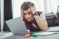 stressed teen boy studying with laptop while lying Royalty Free Stock Photo