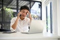 Stressed Asian businessman dealing business with his business client over the phone Royalty Free Stock Photo
