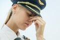 Stressed tired pilot at work in the airport, exhausted from flying Royalty Free Stock Photo