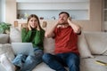 Stressed unhappy couple suffering from noisy neighbor. Disadvantages of living in apartment building