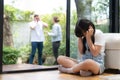 Stressed and unhappy young girl hide from domestic violence at home. Synchronos Royalty Free Stock Photo