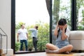 Stressed and unhappy young girl hide from domestic violence at home. Synchronos Royalty Free Stock Photo