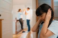 Stressed and unhappy young girl hide from domestic violence at home. Synchronos Royalty Free Stock Photo