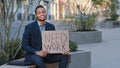 Stressed upset sad desperate hopeless ethnic student holding poster need work. African American businessman entrepreneur Royalty Free Stock Photo