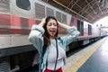 Stressed upset young Asian backpacker feeling shock and depression after miss a train. Problem and travel lifestyle concept Royalty Free Stock Photo