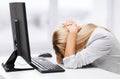 Stressed woman with computer Royalty Free Stock Photo