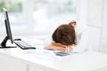 Stressed woman with computer, papers, calculator Royalty Free Stock Photo