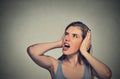 Stressed woman covering her ears looking up Royalty Free Stock Photo